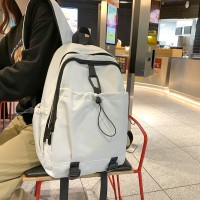 时尚简约小众书包高颜值纯色小学生背包女日系轻便初中生双肩包男