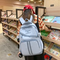 新款小众初中生ins潮流双肩包男大容量小学生书包女森系校园背包