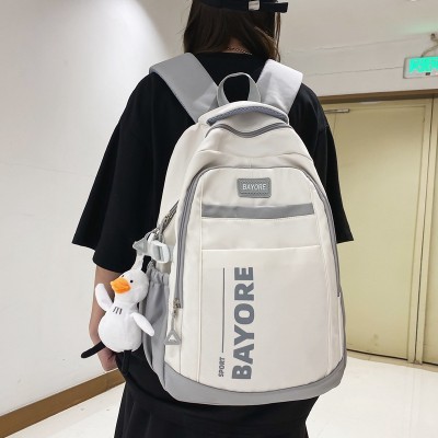 <!--新款双肩包轻便简约大学生电脑背包男孩大容量小众初高中生书包女-->