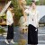 米杏上衣+黑色半裙  